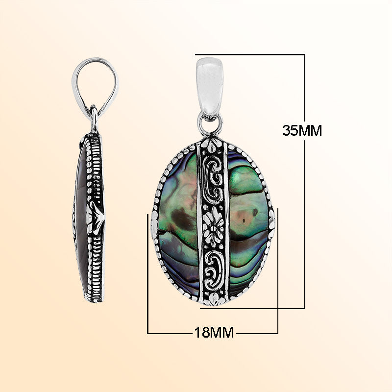 Elegant Sterling Silver Abalone Shell oval pendant with handcrafted floral center detailing, mirror-polished glossy surface, and ocean-inspired iridescence for women’s artistic jewelry collections.