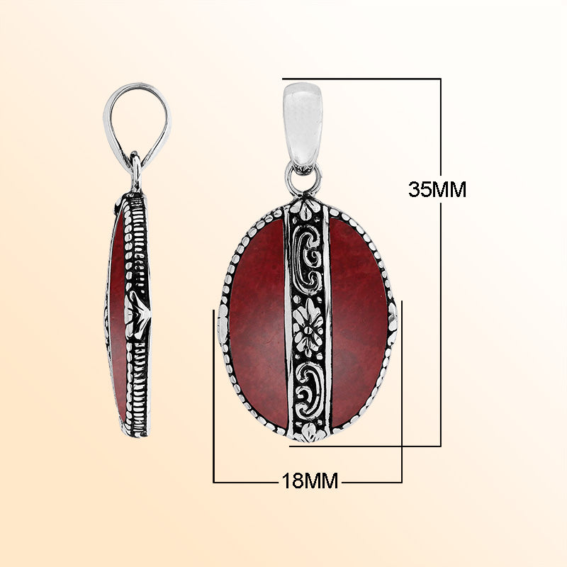 Elegant Sterling Silver Red Coral oval pendant featuring floral center design, handcrafted mirror-polished finish, and vibrant red tones for women’s artistic jewelry collections.