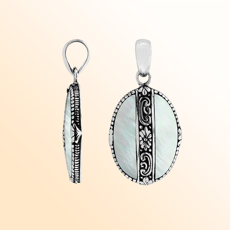 Elegant Sterling Silver Mother Of Pearl oval pendant with floral center detailing, handcrafted mirror-polished finish, and luminous white tone for women’s artistic jewelry collections.