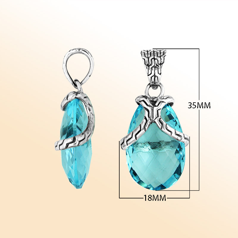 Elegant Sterling Silver Blue Topaz Quartz pear pendant featuring textured bail design, handcrafted mirror-polished finish, and radiant blue tone for women’s artistic jewelry collections.