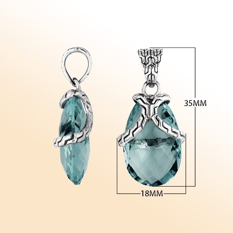Elegant Sterling Silver London Blue Topaz Quartz pear pendant featuring textured bail design, handcrafted mirror-polished finish, and deep blue tone for women’s artistic jewelry collections.