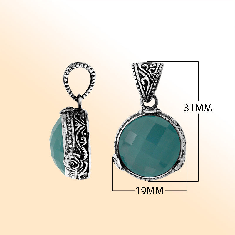 A round 925 sterling silver pendant featuring a faceted Blue Chalcedony Quartz stone with intricate Balinese metalwork, handcrafted detailing, and elegant artistic styling for women.