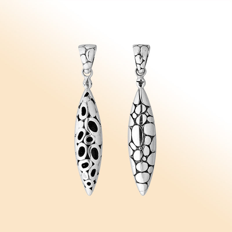 Artistic sterling silver long teardrop pendant with raised pebble texture handcrafted in Balinese design