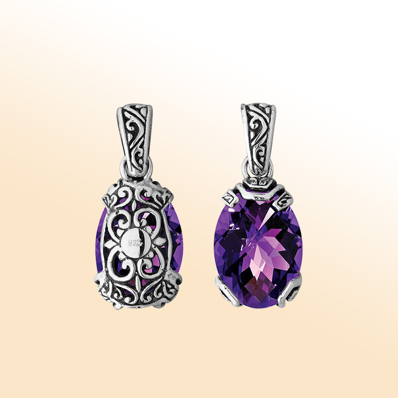 An elegant sterling silver pendant featuring a faceted Amethyst Quartz set within a detailed Balinese filigree frame, symbolizing luxury and handcrafted artistry.