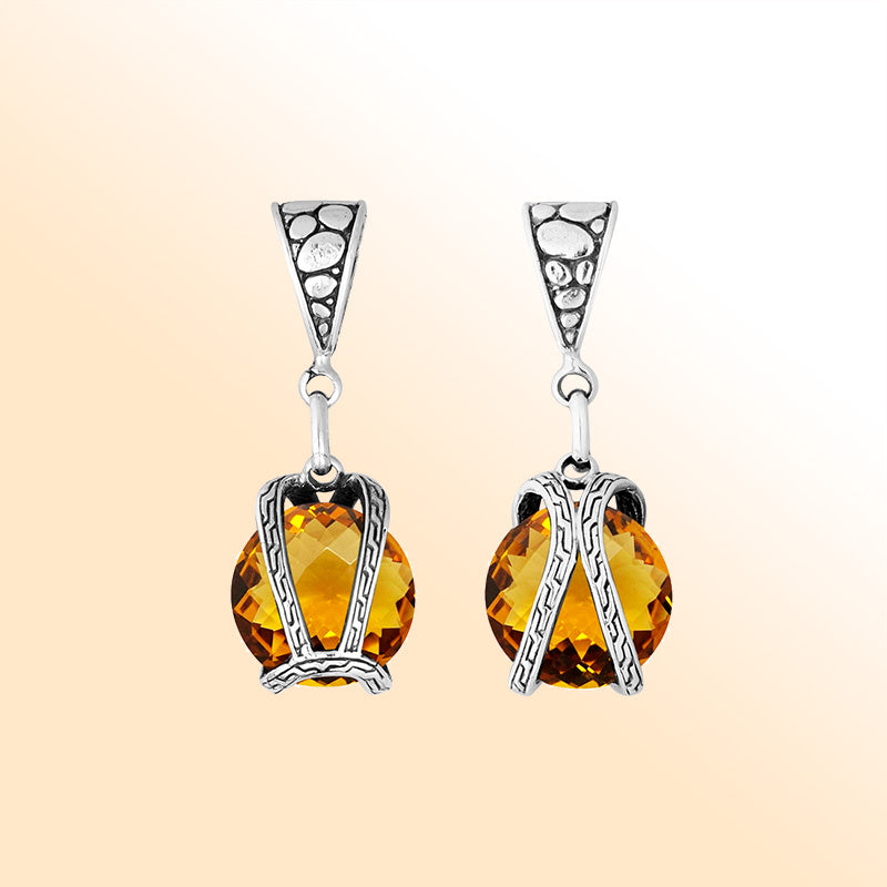 An elegant sterling silver pendant featuring a glowing Citrine Quartz in a handcrafted dual rope frame, designed with Balinese artistry and fine detail.
