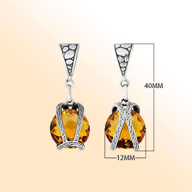 An elegant sterling silver pendant featuring a glowing Citrine Quartz in a handcrafted dual rope frame, designed with Balinese artistry and fine detail.