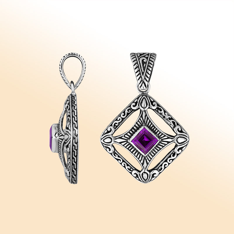 An elegant sterling silver pendant featuring a radiant Amethyst Quartz at the center of an ornate Balinese filigree design, handcrafted with intricate detail.