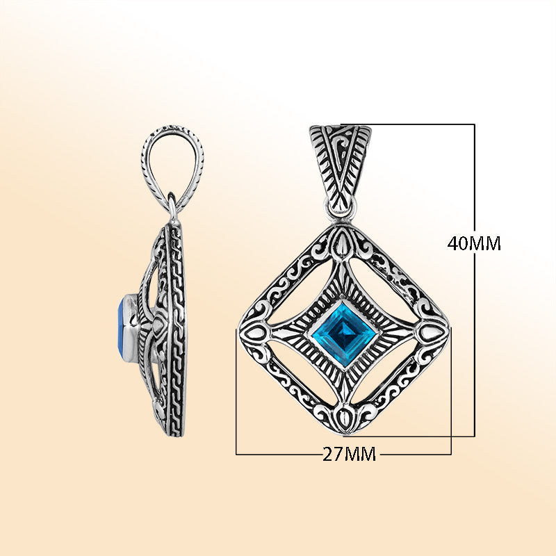 An elegant sterling silver pendant featuring a vivid Blue Topaz Quartz in an ornate Balinese filigree frame, handcrafted with refined silver artistry.