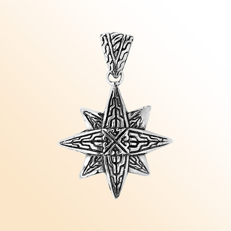 A stunning sterling silver compass star pendant handcrafted with Balinese tribal engraving and polished finish, symbolizing direction and purpose.