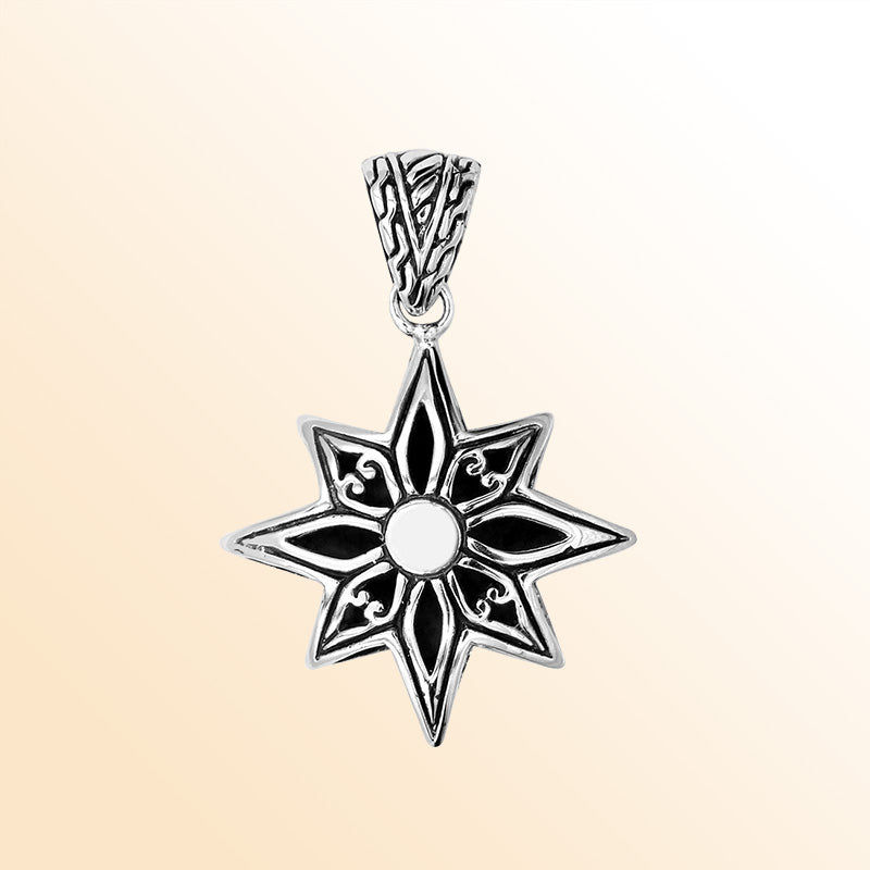 A stunning sterling silver compass star pendant handcrafted with Balinese tribal engraving and polished finish, symbolizing direction and purpose.
