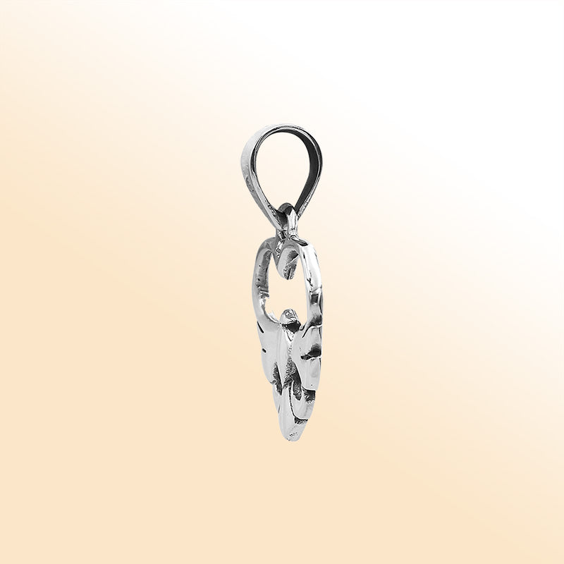 An elegant sterling silver heart and dove pendant handcrafted with Balinese artistry and a smooth, polished finish symbolizing peace and love.