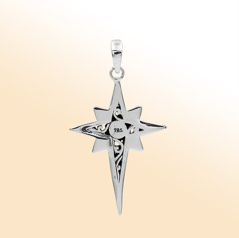 An elegant sterling silver compass star pendant handcrafted with Balinese filigree and a mirror-polished artistic finish symbolizing guidance and strength.