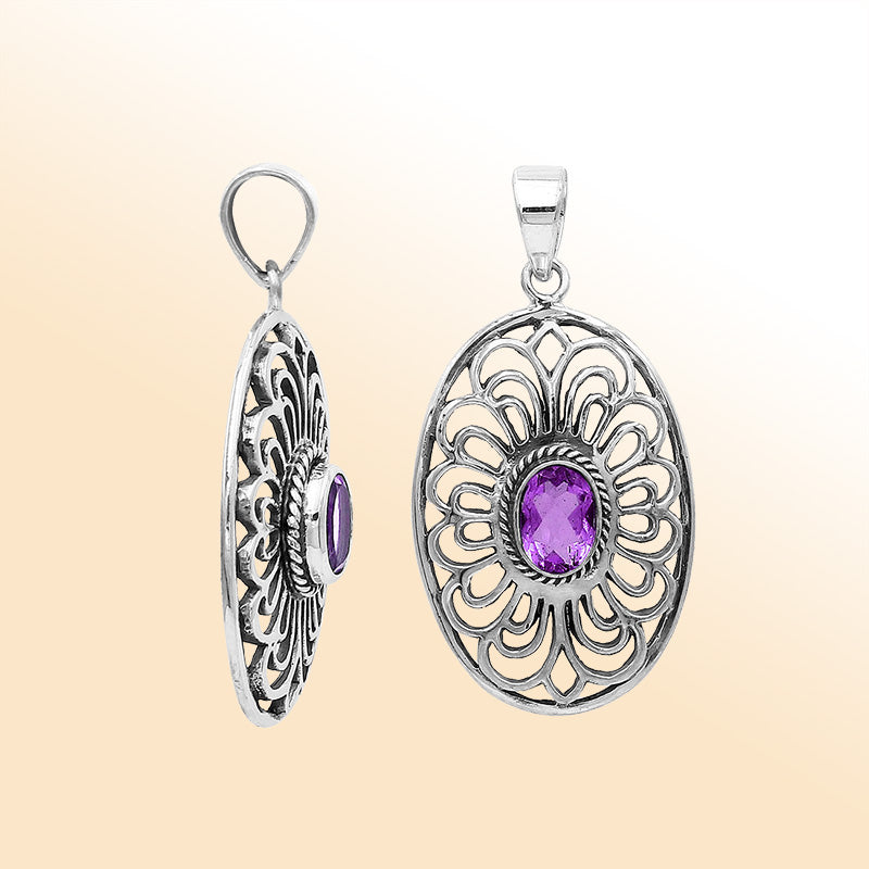 An elegant sterling silver oval pendant featuring an Amethyst Quartz gemstone with detailed Balinese filigree and polished craftsmanship.