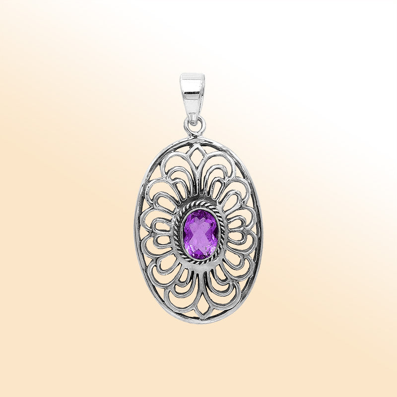 An elegant sterling silver oval pendant featuring an Amethyst Quartz gemstone with detailed Balinese filigree and polished craftsmanship.