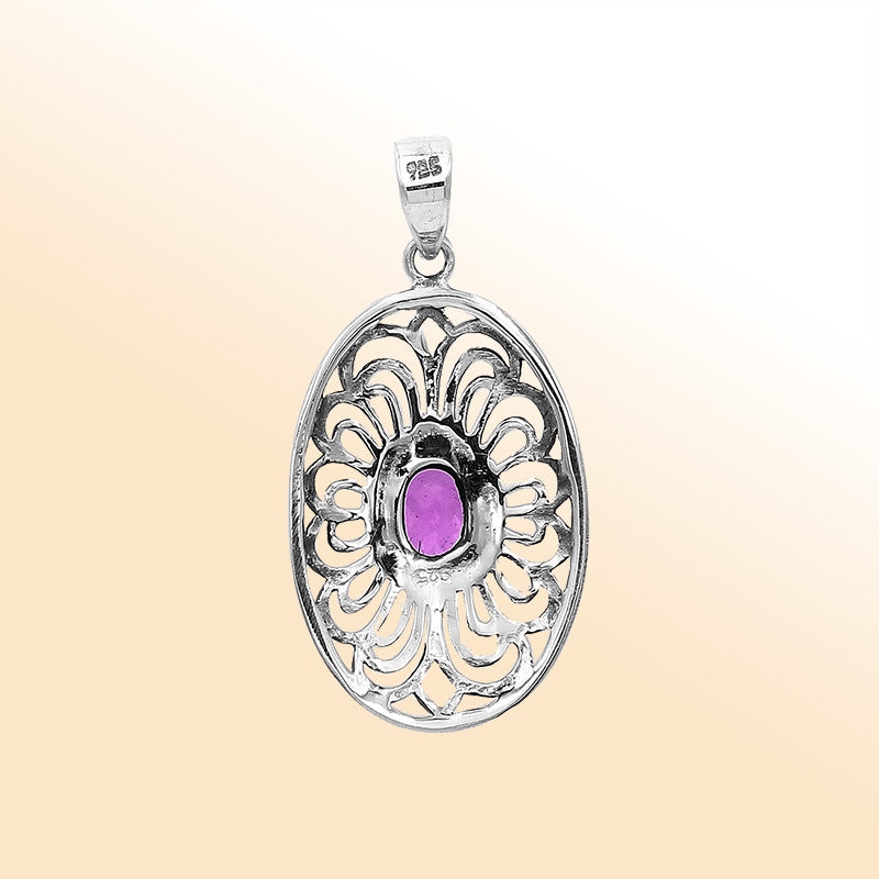 An elegant sterling silver oval pendant featuring an Amethyst Quartz gemstone with detailed Balinese filigree and polished craftsmanship.
