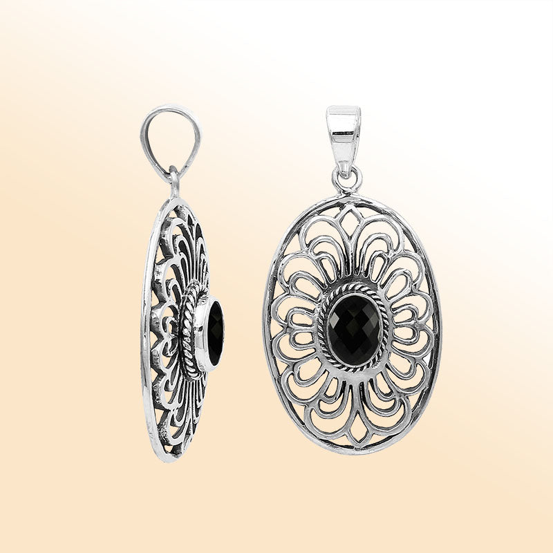 An elegant sterling silver oval pendant featuring a Black Onyx with detailed Balinese filigree and polished craftsmanship.
