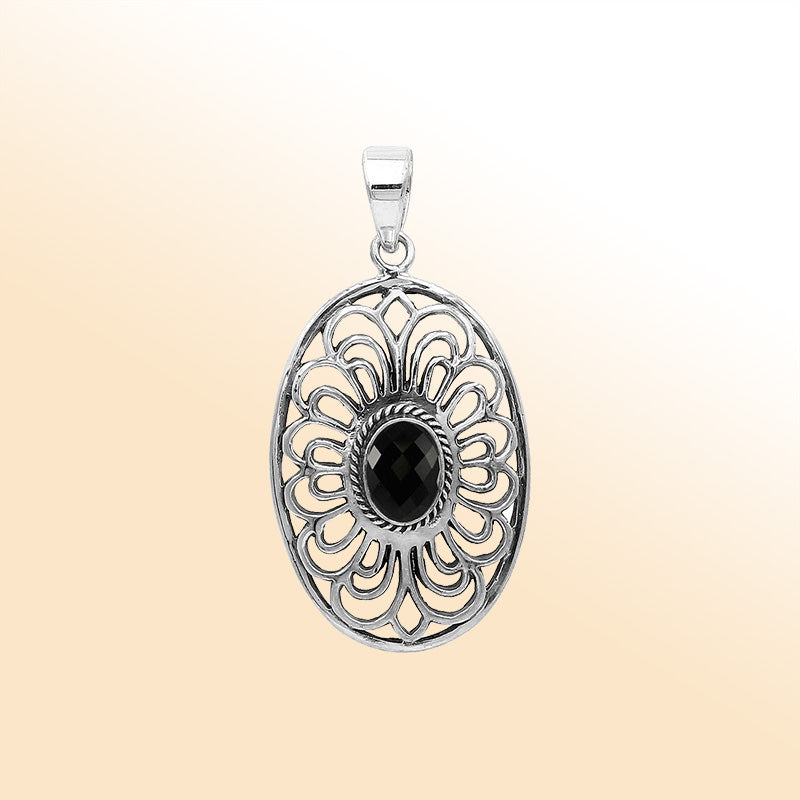 An elegant sterling silver oval pendant featuring a Black Onyx with detailed Balinese filigree and polished craftsmanship.