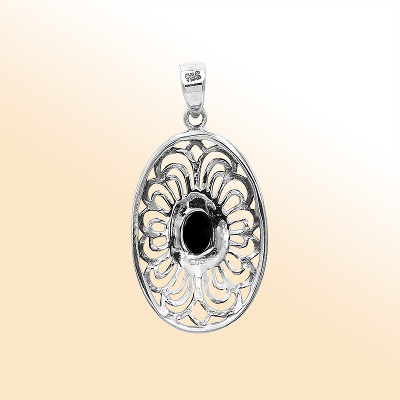 An elegant sterling silver oval pendant featuring a Black Onyx with detailed Balinese filigree and polished craftsmanship.
