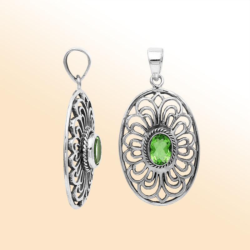 Elegant sterling silver oval pendant featuring Peridot Quartz with handcrafted Balinese filigree detailing and polished silver finish.