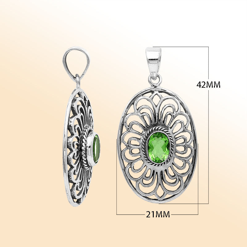 Elegant sterling silver oval pendant featuring Peridot Quartz with handcrafted Balinese filigree detailing and polished silver finish.