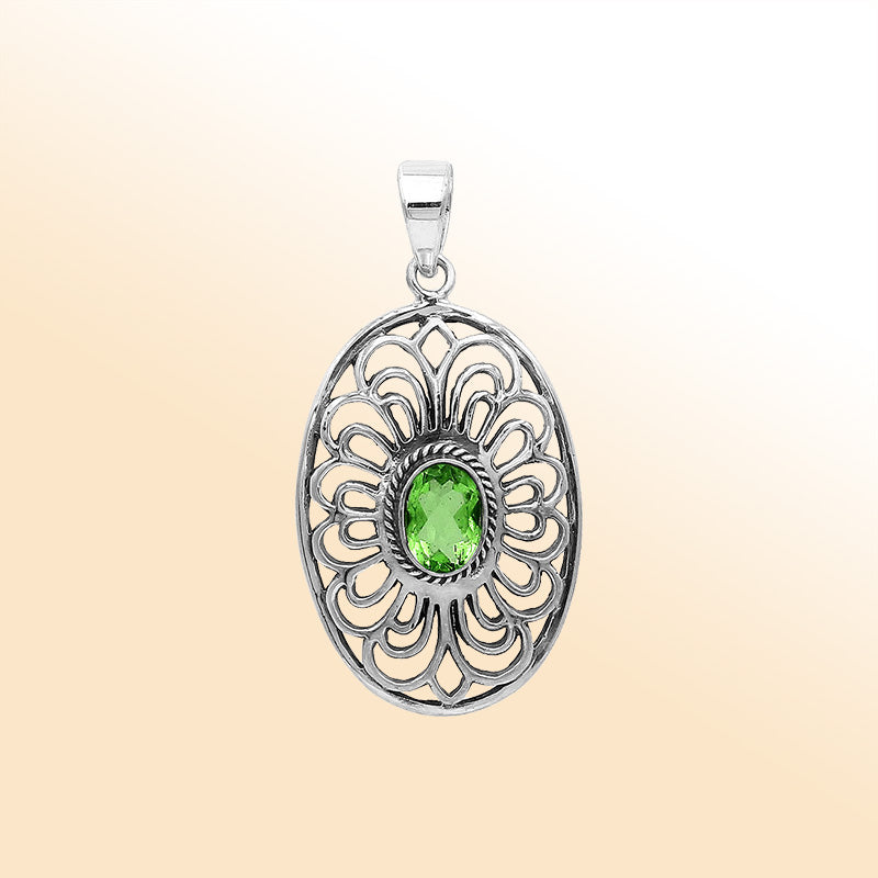 Elegant sterling silver oval pendant featuring Peridot Quartz with handcrafted Balinese filigree detailing and polished silver finish.