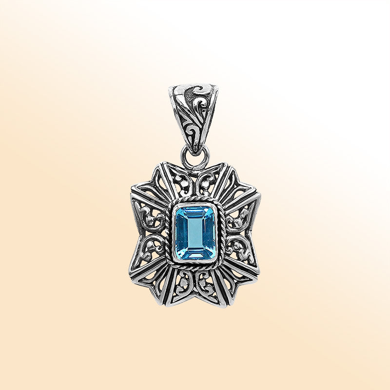 Elegant sterling silver Blue Topaz Quartz pendant with artistic Balinese handcrafted filigree design.
