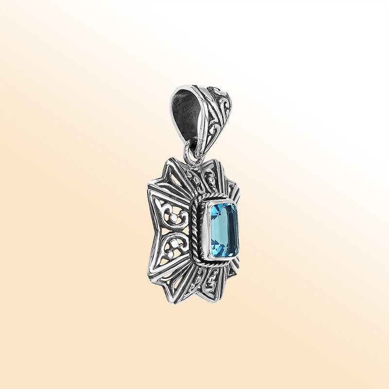 Elegant sterling silver Blue Topaz Quartz pendant with artistic Balinese handcrafted filigree design.
