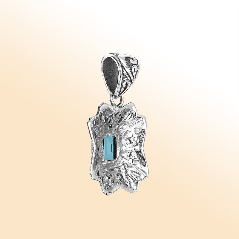 Elegant sterling silver Blue Topaz Quartz pendant with artistic Balinese handcrafted filigree design.