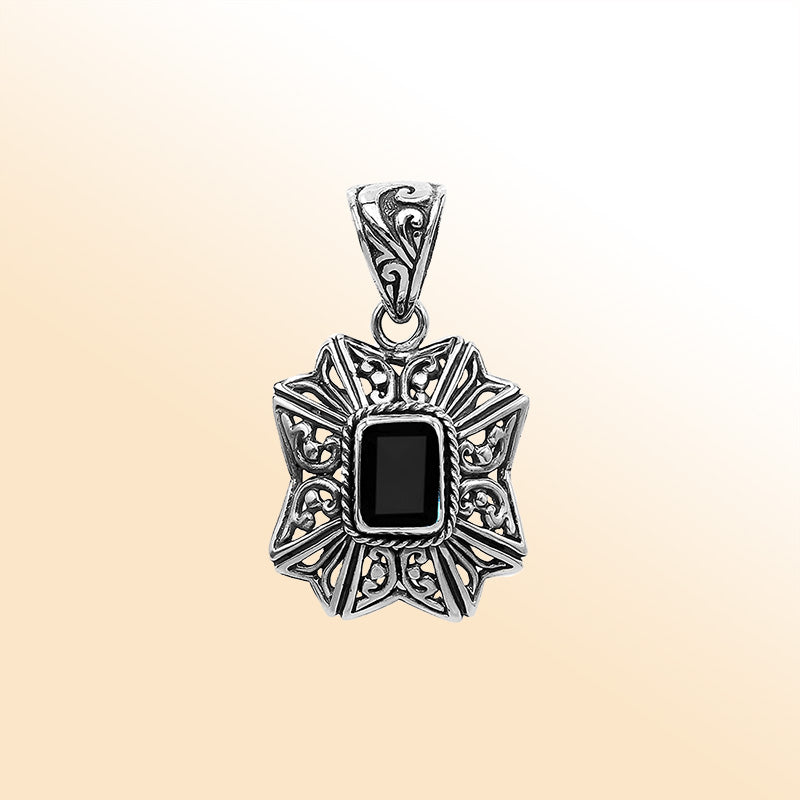 Elegant sterling silver radiant star pendant featuring Black Onyx centerpiece with artistic filigree detailing and high-gloss finish.
