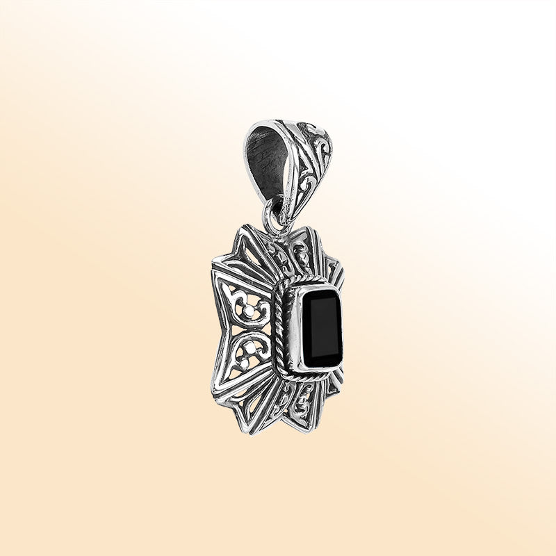Elegant sterling silver radiant star pendant featuring Black Onyx centerpiece with artistic filigree detailing and high-gloss finish.