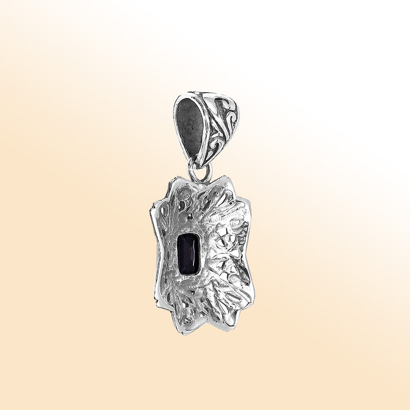 Elegant sterling silver radiant star pendant featuring Black Onyx centerpiece with artistic filigree detailing and high-gloss finish.