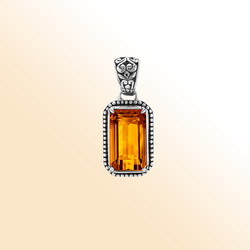 Elegant sterling silver rectangular pendant featuring Citrine Quartz center with artistic beaded border and polished finish.