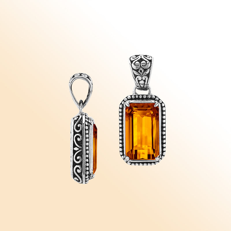 Elegant sterling silver rectangular pendant featuring Citrine Quartz center with artistic beaded border and polished finish.