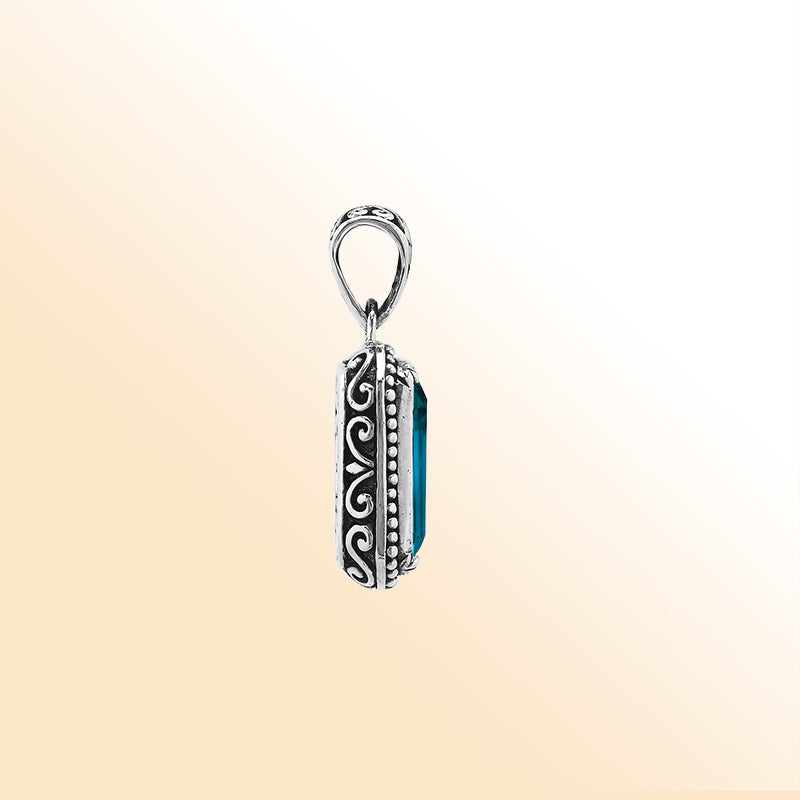 Elegant sterling silver rectangular pendant with London Blue Topaz Quartz center and artistic beaded border craftsmanship.