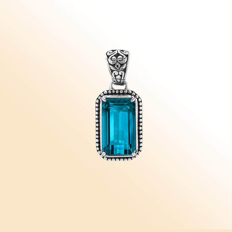 Elegant sterling silver rectangular pendant with London Blue Topaz Quartz center and artistic beaded border craftsmanship.