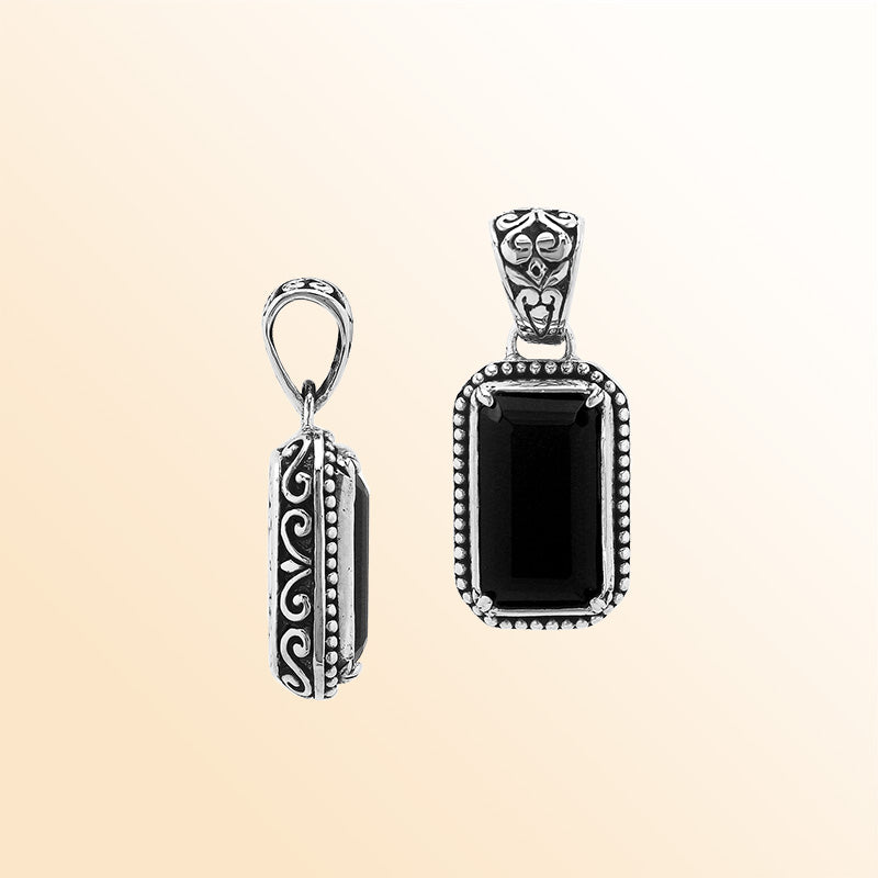 Elegant sterling silver rectangular pendant featuring Black Onyx center with artistic beaded border and polished finish.