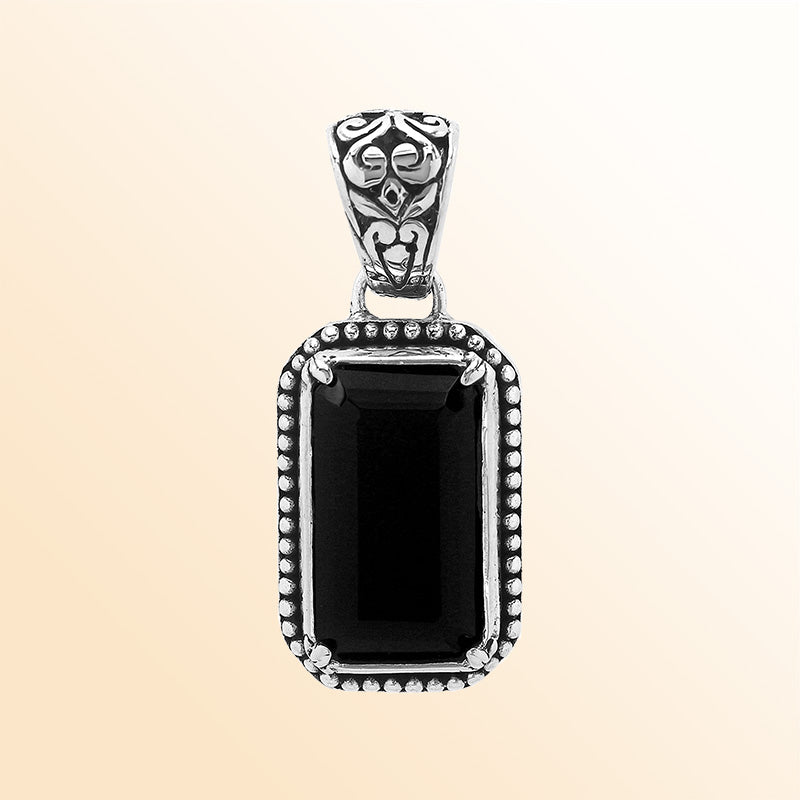 Elegant sterling silver rectangular pendant featuring Black Onyx center with artistic beaded border and polished finish.