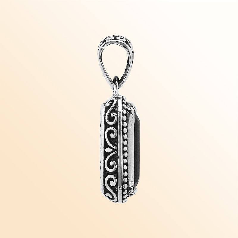 Elegant sterling silver rectangular pendant featuring Black Onyx center with artistic beaded border and polished finish.