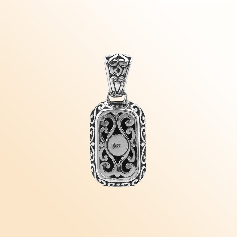 Elegant sterling silver rectangular pendant featuring Black Onyx center with artistic beaded border and polished finish.