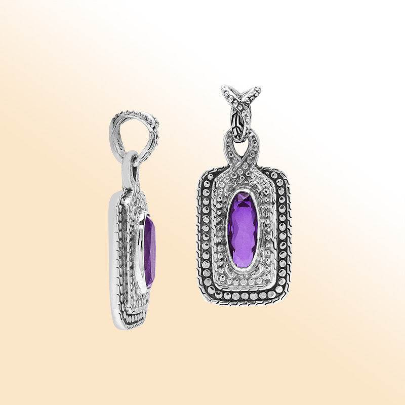 Elegant sterling silver oval pendant featuring Amethyst Quartz center with artistic beaded frame and polished finish.