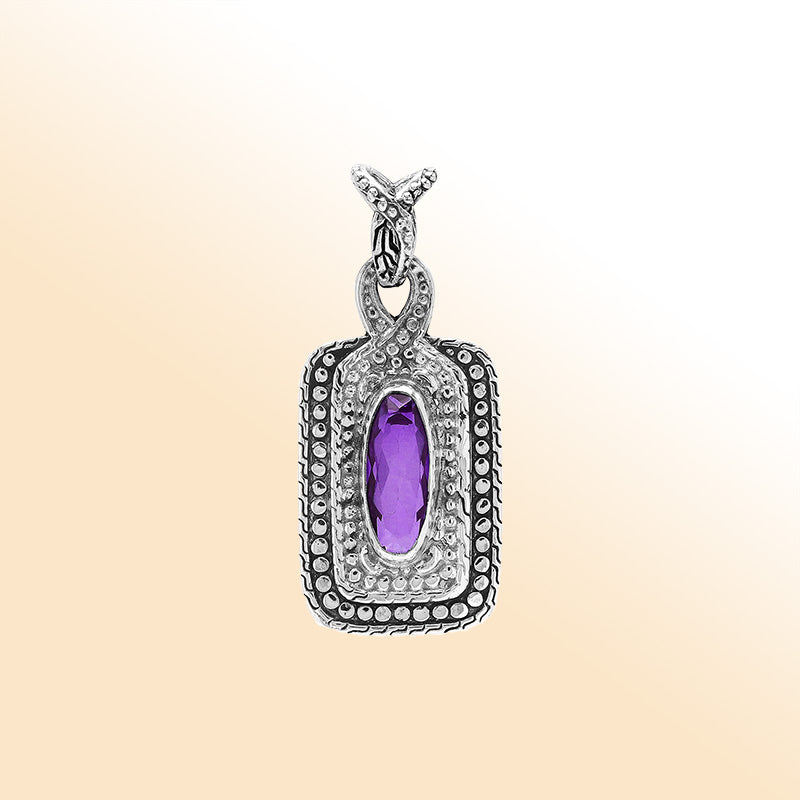 Elegant sterling silver oval pendant featuring Amethyst Quartz center with artistic beaded frame and polished finish.