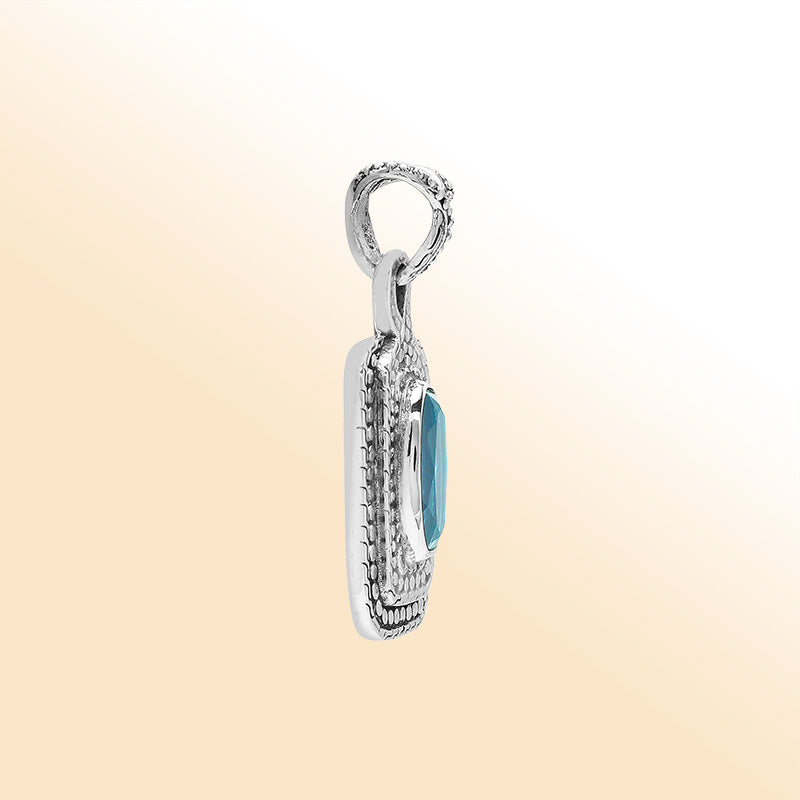 Elegant sterling silver oval pendant featuring Blue Topaz Quartz center with artistic beaded frame and polished silver finish.