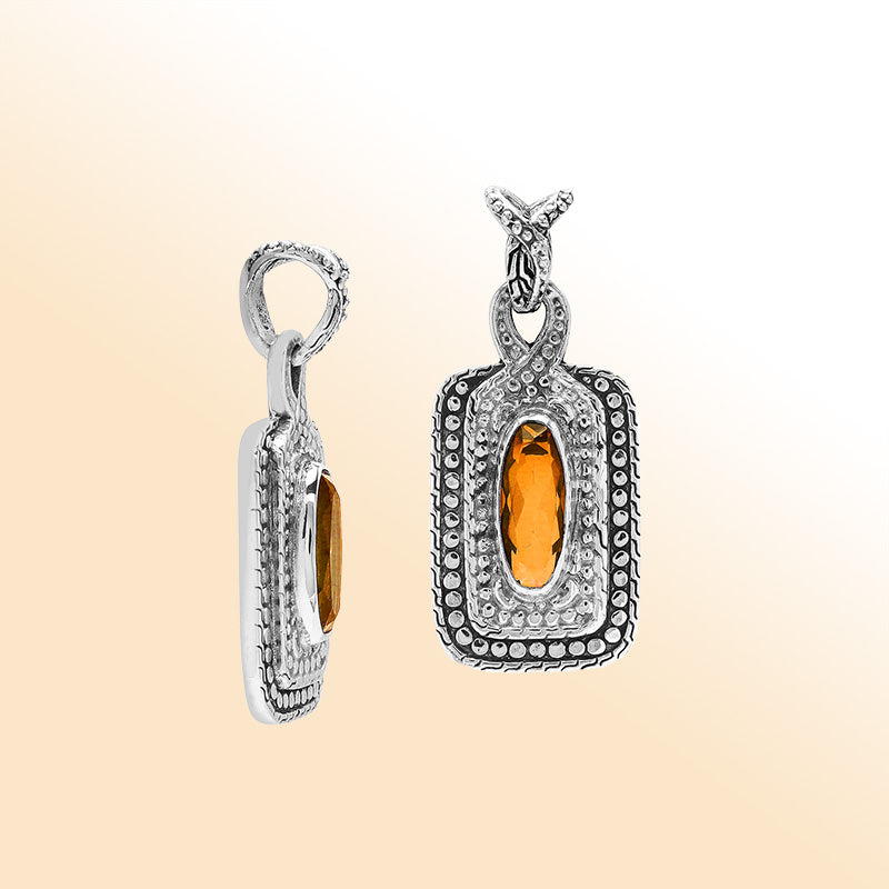 Elegant sterling silver oval pendant featuring Citrine Quartz center with artistic beaded frame and polished finish.