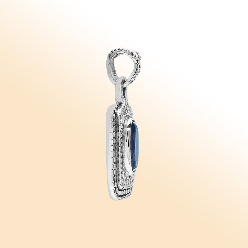 Elegant sterling silver oval pendant featuring London Blue Topaz Quartz center with artistic beaded frame and polished finish.