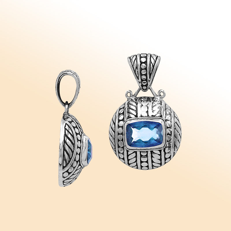 Elegant sterling silver handcrafted pendant featuring Blue Topaz Quartz in Balinese tribal design with oxidized polished finish.