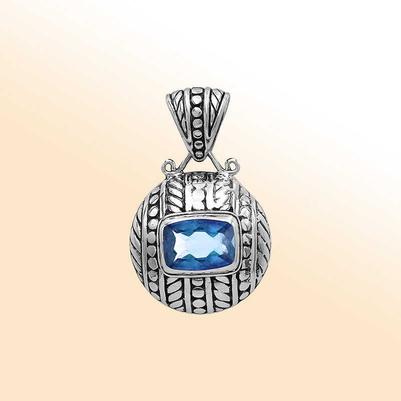 Elegant sterling silver handcrafted pendant featuring Blue Topaz Quartz in Balinese tribal design with oxidized polished finish.
