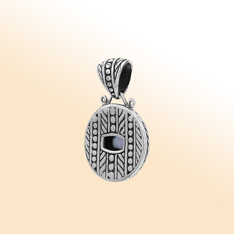 Elegant sterling silver handcrafted pendant featuring Blue Topaz Quartz in Balinese tribal design with oxidized polished finish.
