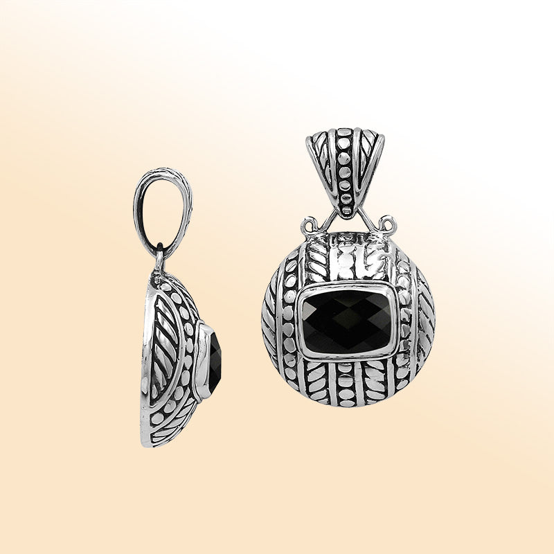 Handcrafted sterling silver pendant with cushion black onyx quartz, detailed leaf engravings, dotted textures, and high-polish finish reflecting Balinese craftsmanship.