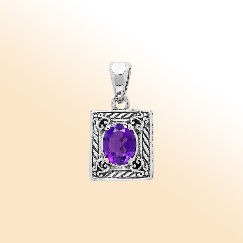 Elegant sterling silver pendant featuring an oval amethyst quartz in a rectangular frame with swirl engravings and polished high-gloss Balinese finish.