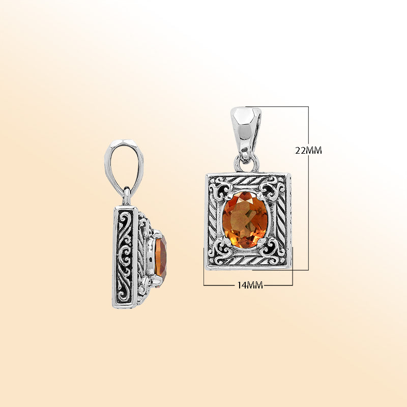 Handcrafted sterling silver pendant with oval citrine quartz, detailed swirl engraving, and mirror-polished surface showcasing Balinese artistry.